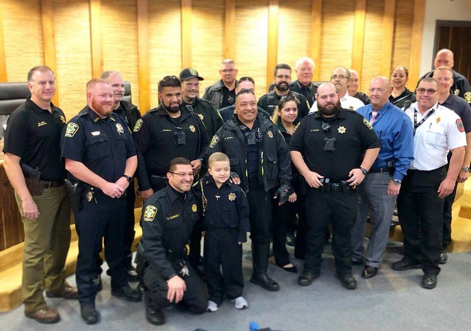Honorary Officer Max joins BPD for a day ahead of Stuff the Sleigh Toy Drive.